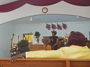 Lauraine and her mom singing a song before the preaching starts.